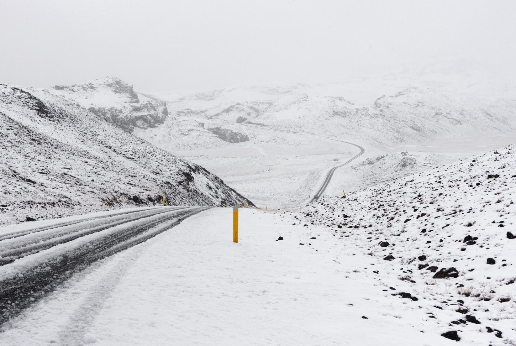 We were travelling in Iceland when a blizzard started. Within 15 minutes the roads and surrounding mountains were covered in snow and a heavy mist hung over the landscape.